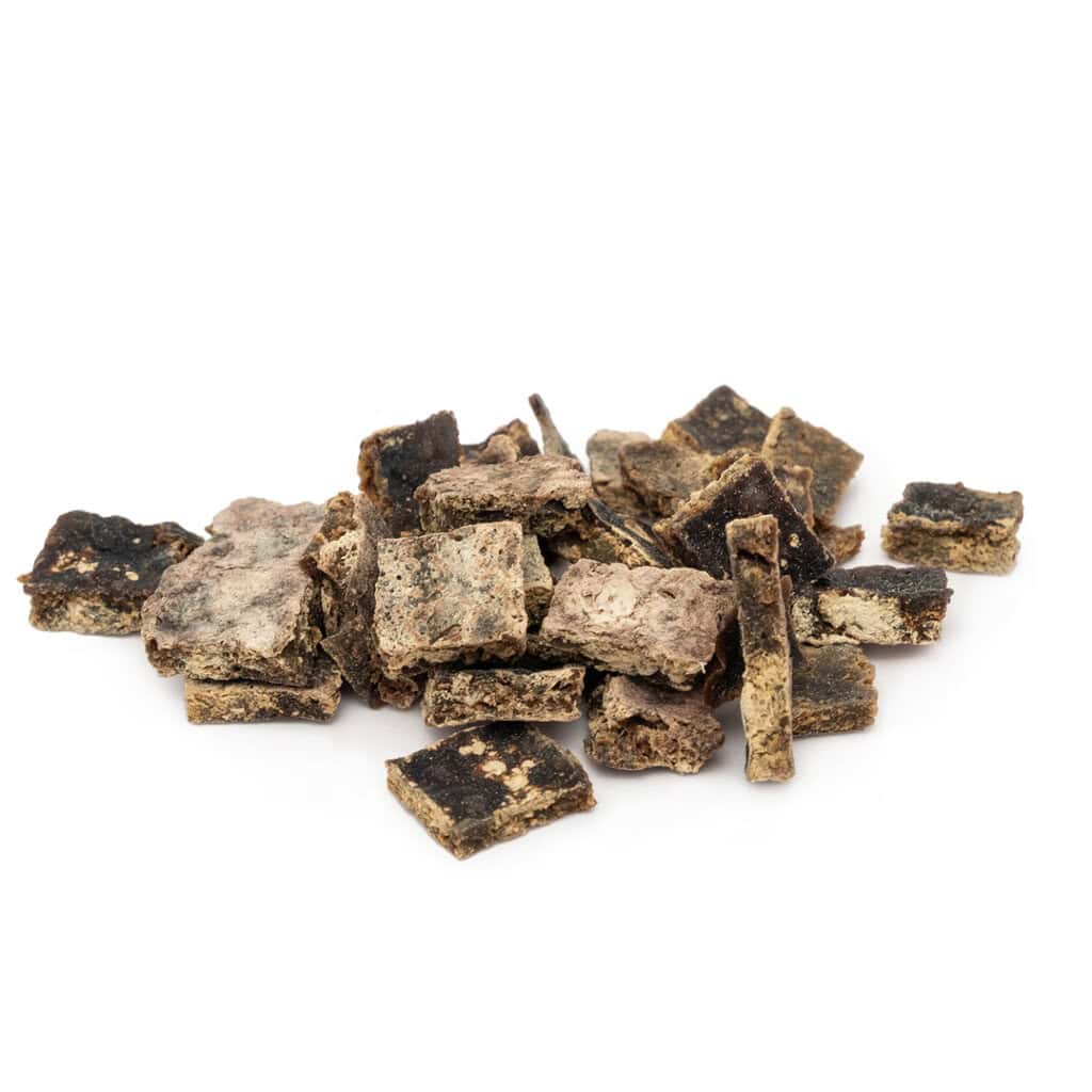 Natural dog treats made from dried meat and vegetables for healthy pet snacking.