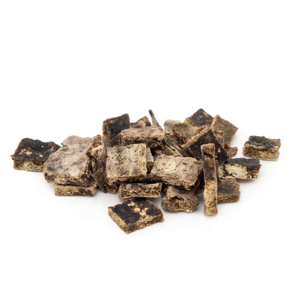 Natural dog treats made from dried meat and vegetables for healthy pet snacks.